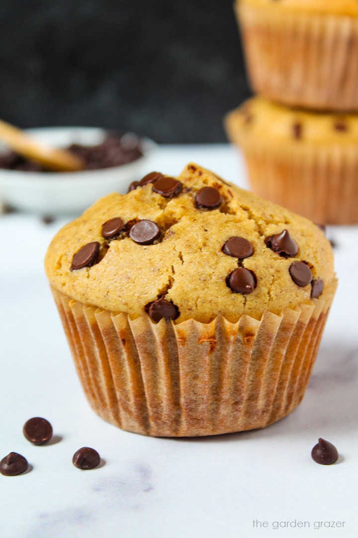 Vegan chocolate chip muffins on a white marble table