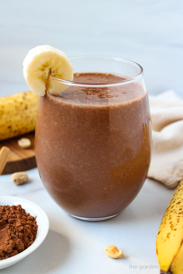 Chunky monkey smoothie with banana, peanut butter, and cocoa powder served in a glass