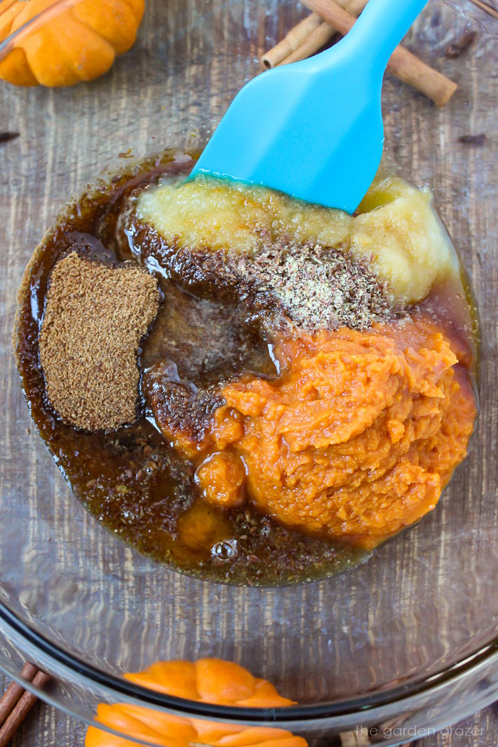Preparing muffin ingredients in a glass bowl before mixing together
