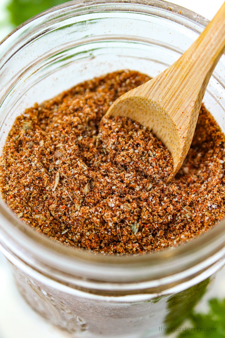 Close up view of chili seasoning recipe mixed together in a small glass jar