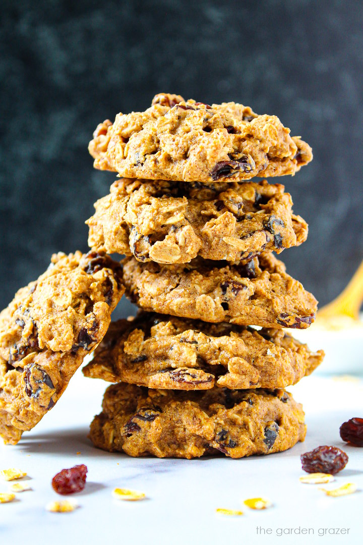 Vegan oatmeal raisin cookies stacked on top of each other