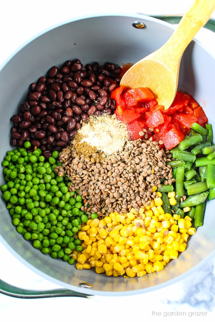 Overhead view of preparing ingredients in a large pot before mixing together