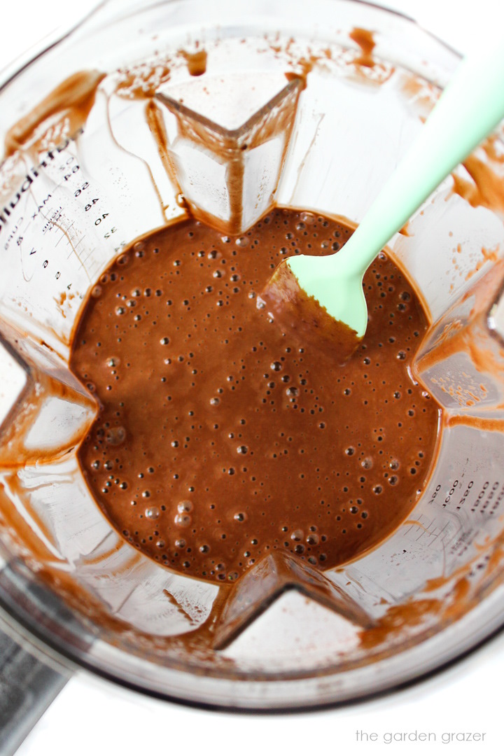 Overhead view of chocolate mixture blended in a large blender